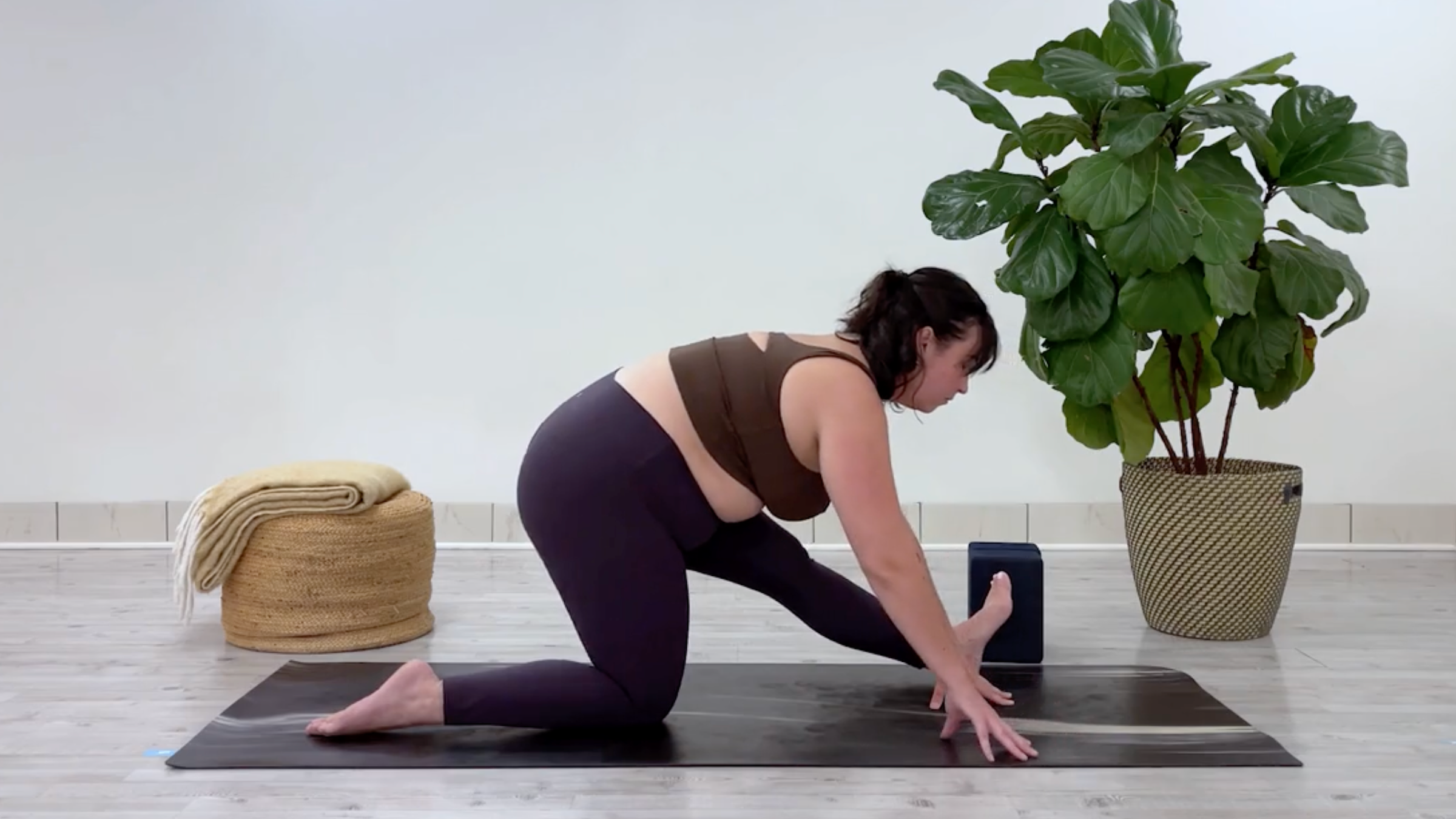 Taylor Lorenz in Half Splits, part of her yoga for stress relief flow for back to school season